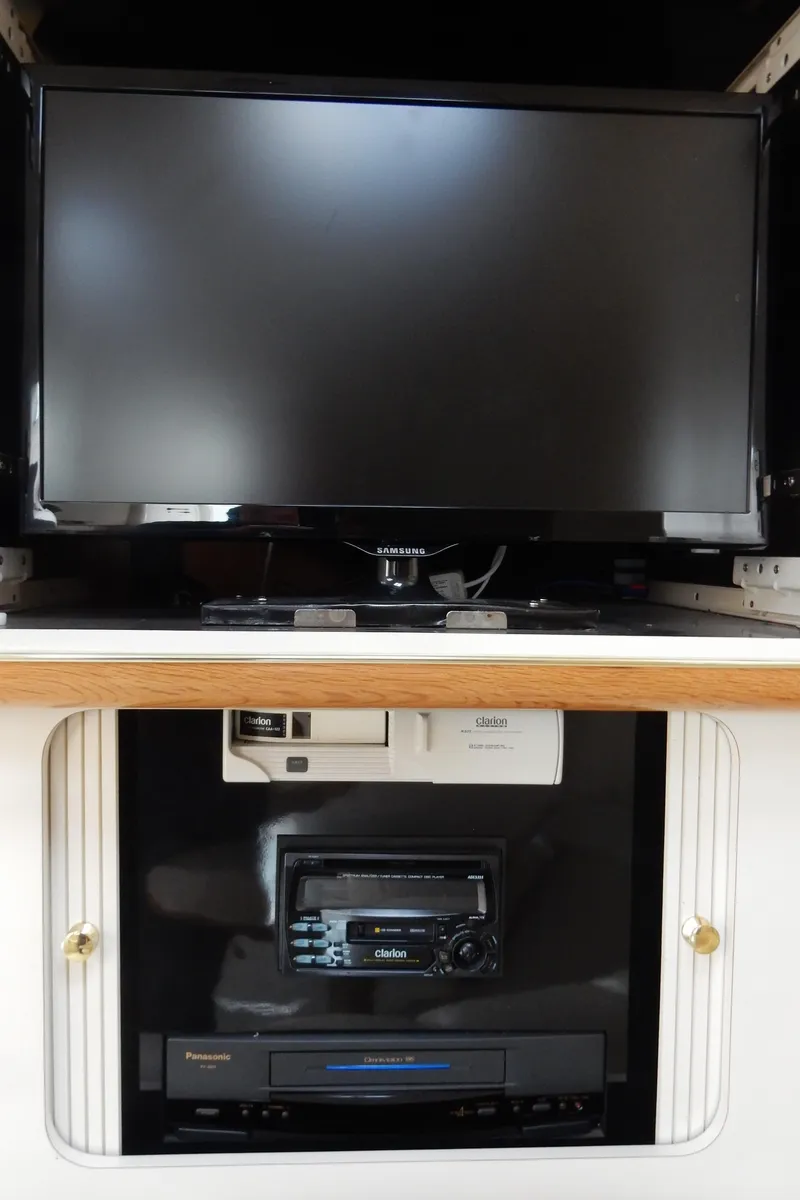 Slide: The Image of Entertainment system in 1997 Sea Ray 450 yacht with TV and audio equipment. - 28