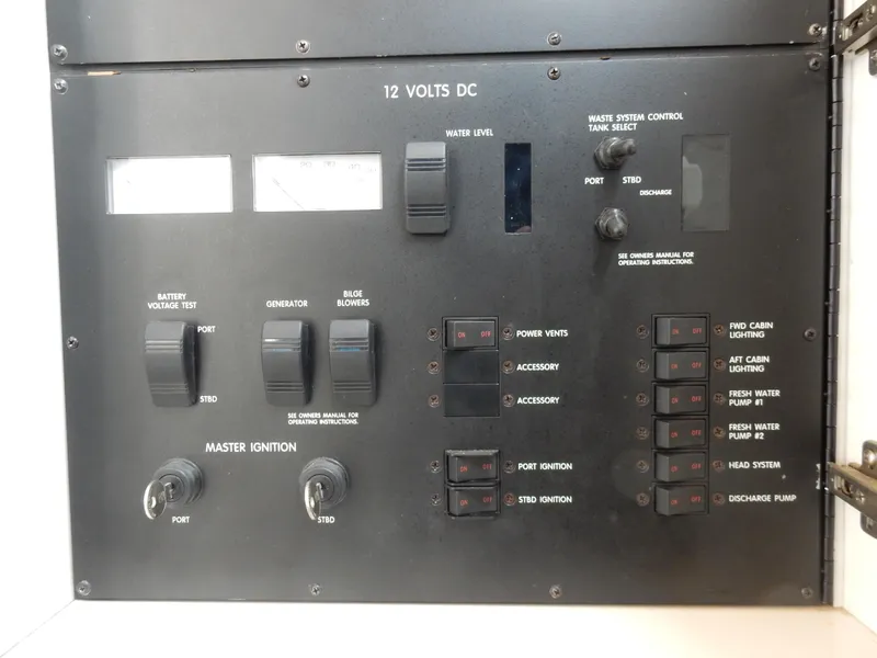 Slide: The Image of Control panel of a 1997 Sea Ray 450 boat, featuring switches and gauges for various functions. - 29