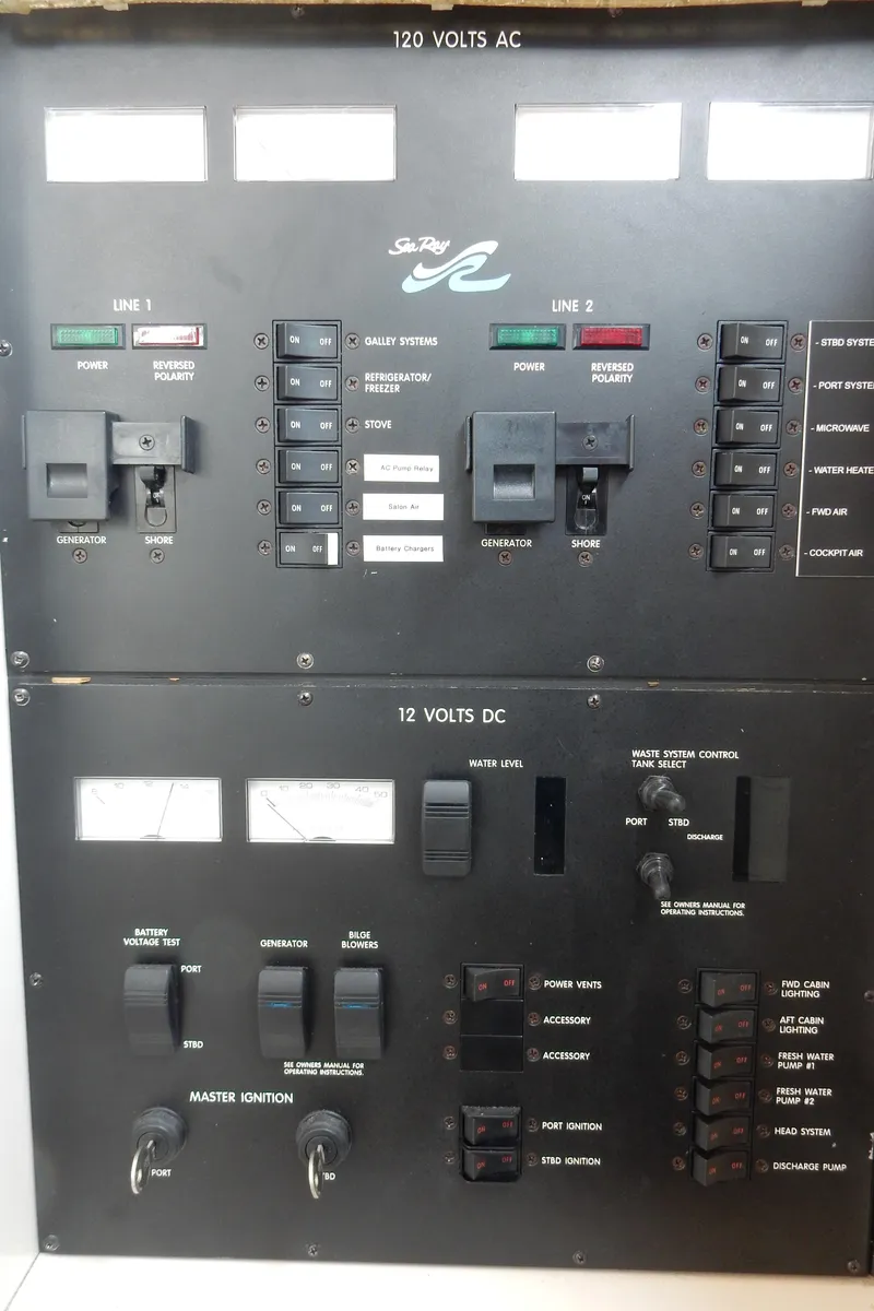 Slide: The Image of Electrical control panel of a 1997 Sea Ray 450 yacht, featuring 120V AC and 12V DC systems. - 31
