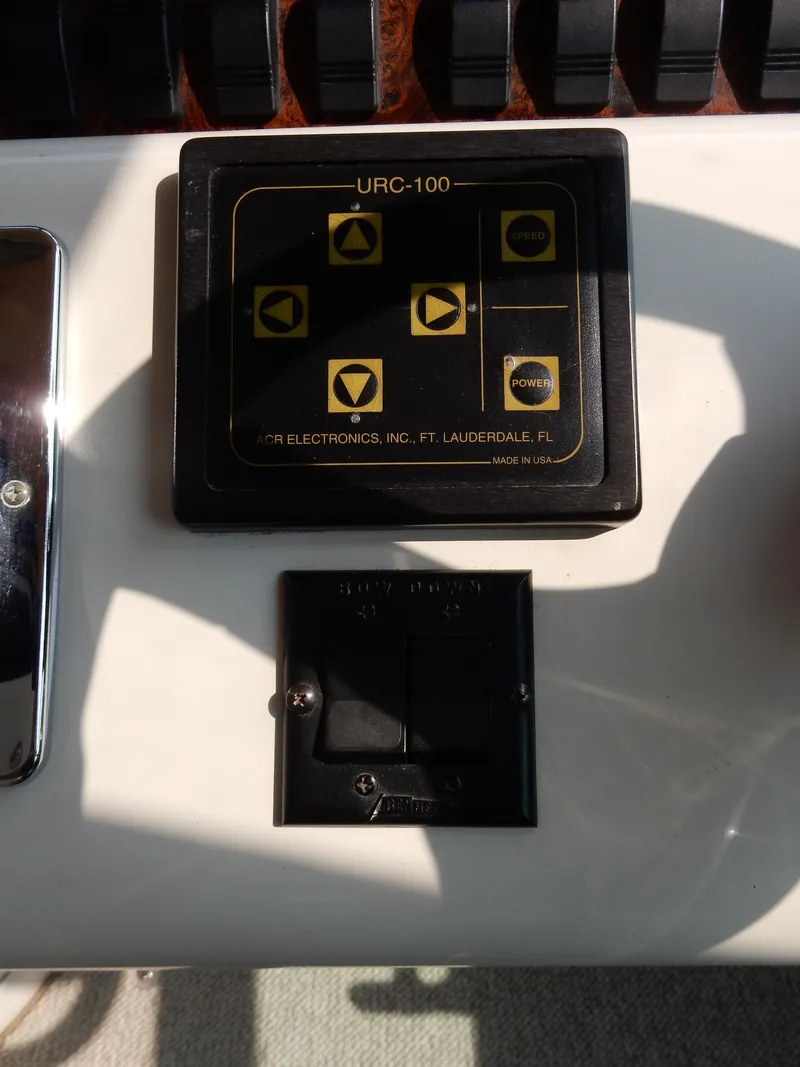 Slide: The Image of Control panel on a 1997 Sea Ray 450 boat, featuring URC-100 interface. - 36
