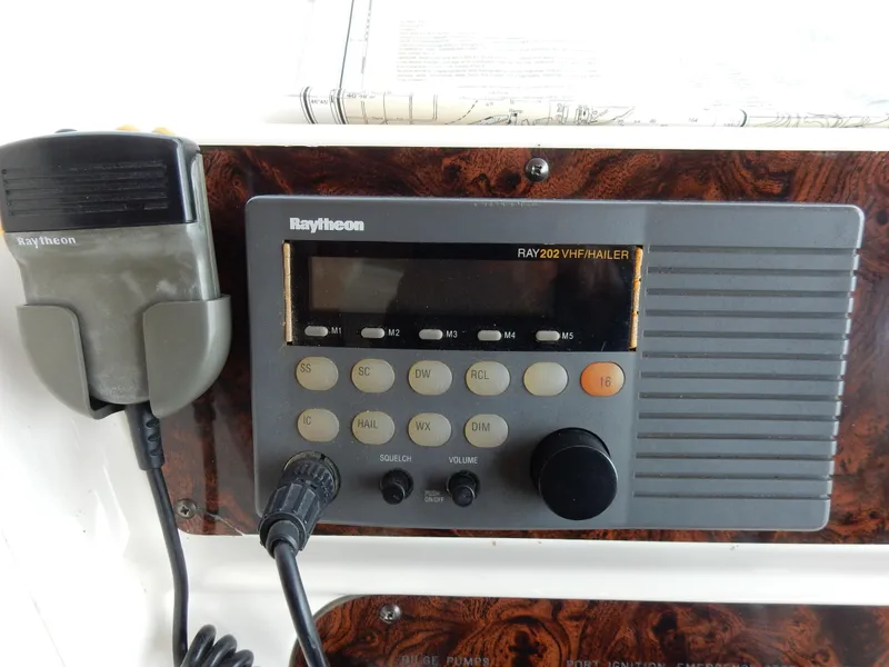 Slide: The Image of Raytheon RAY202 VHF marine radio on 1997 Sea Ray 450 control panel. - 37