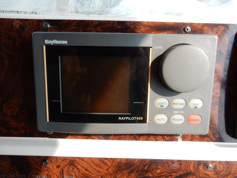 Slide: The Image of Raytheon Raypilot 650 autopilot system on 1997 Sea Ray 450 yacht dashboard. - 38
