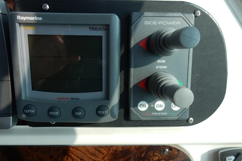 Slide: The Image of Control panel of a 1997 Sea Ray 450, featuring Raymarine Tridata and Side-Power controls. - 40