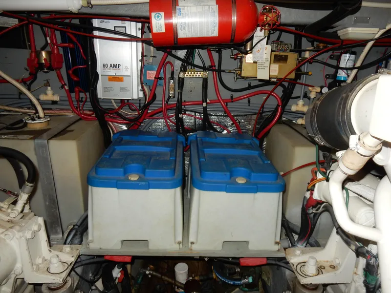 Slide: The Image of Engine room of 1997 Sea Ray 450 with batteries and wiring. - 43