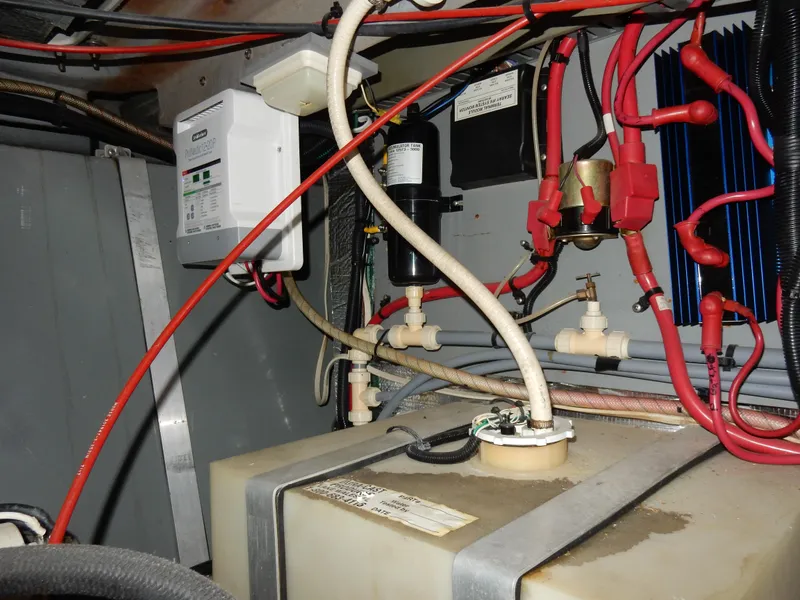 Slide: The Image of Engine compartment of a 1997 Sea Ray 450, showing wiring and components. - 44