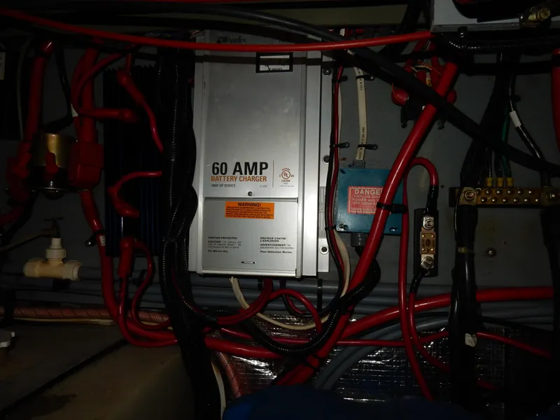 Slide: The Image of Electrical system of a 1997 Sea Ray 450, featuring a 60 AMP battery charger. - 45