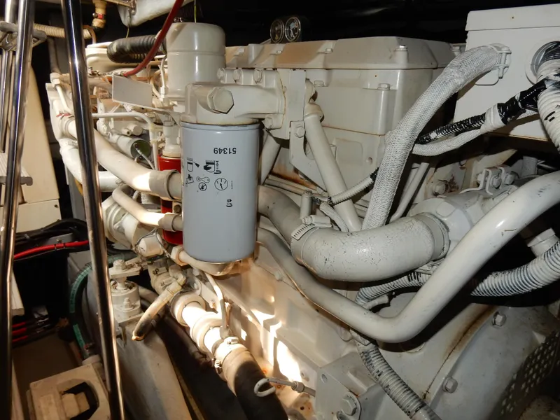 Slide: The Image of Engine compartment of a 1997 Sea Ray 450, showcasing detailed mechanical components. - 46
