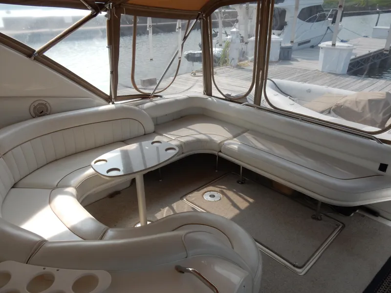 Slide: The Image of Luxurious 1997 Sea Ray 450 yacht interior with plush seating and waterfront view. - 9