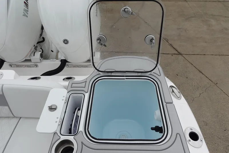 Slide: The Image of 2025 Sea Fox 268 Commander boat with open storage compartment and dual engines. - 10