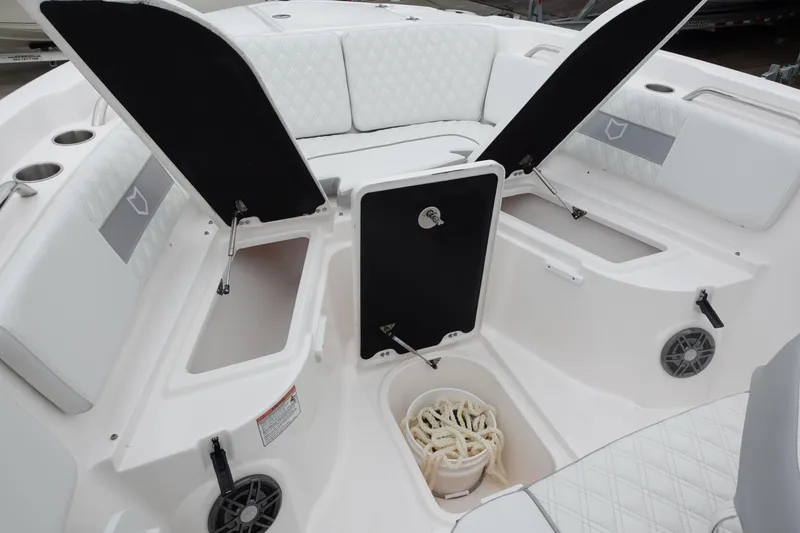 Slide: The Image of 2025 Sea Fox 268 Commander boat interior with open storage compartments and seating. - 16