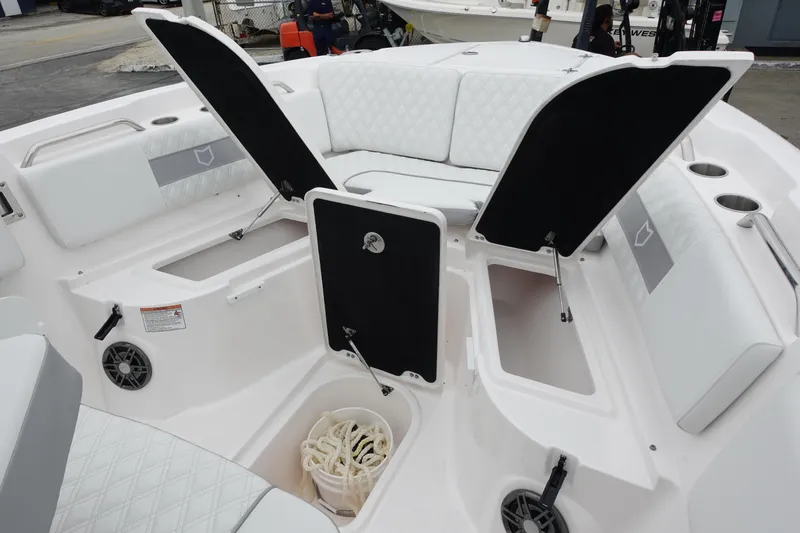 Slide: The Image of 2025 Sea Fox 268 Commander boat interior with open storage compartments and seating. - 17