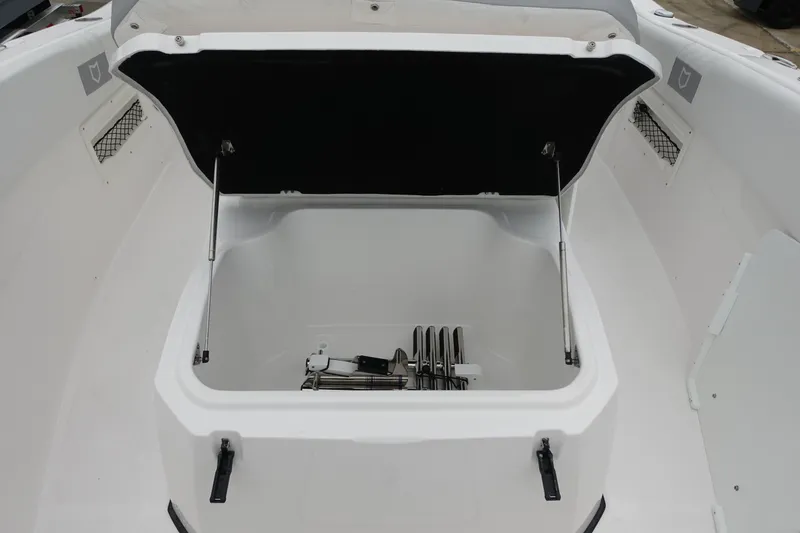 Slide: The Image of 2025 Sea Fox 268 Commander boat storage compartment with open lid and visible equipment. - 21
