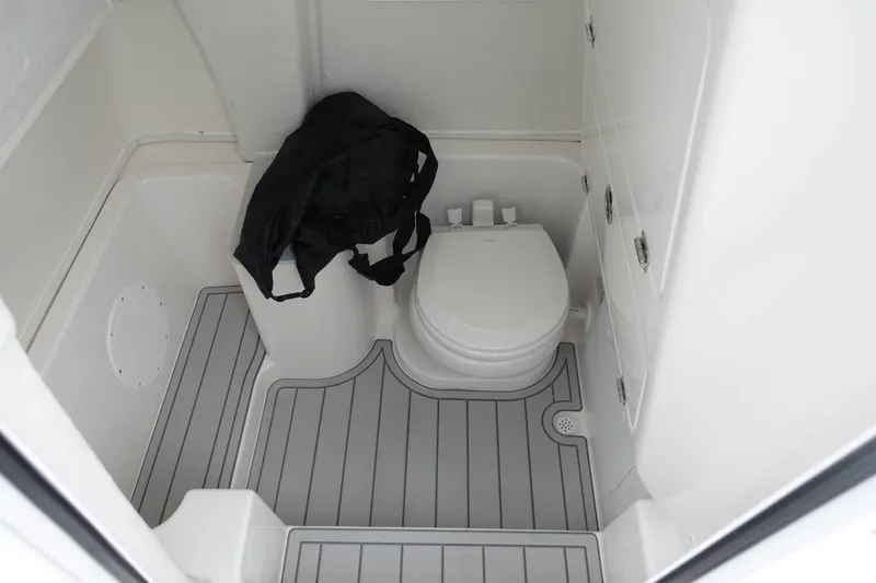 Slide: The Image of 2025 Sea Fox 268 Commander boat interior with toilet and storage area. - 23