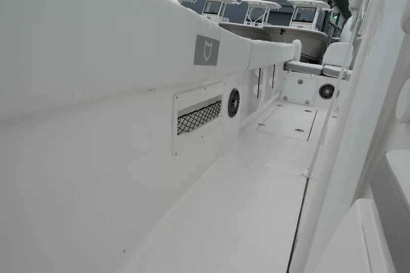 Slide: The Image of 2025 Sea Fox 268 Commander boat interior with sleek white design and storage features. - 27