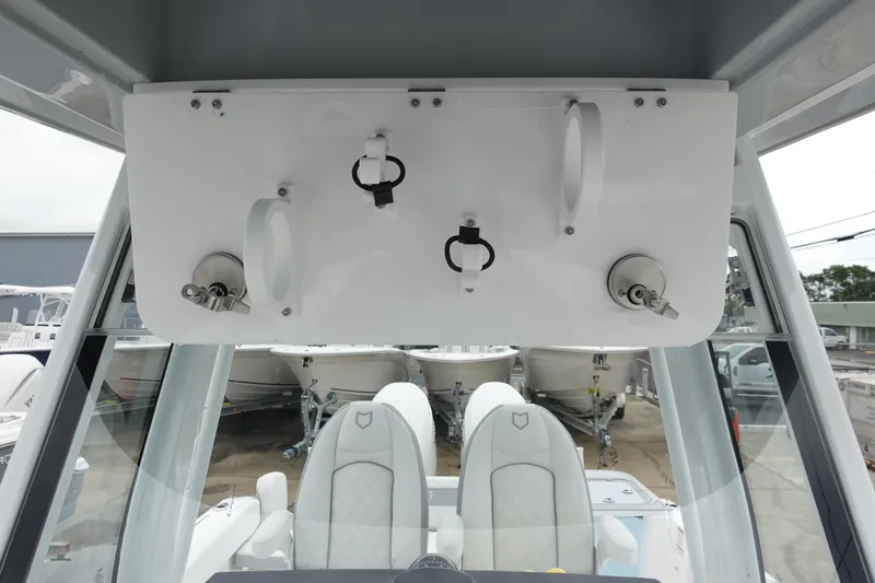 Slide: The Image of 2025 Sea Fox 268 Commander boat interior with rod holders and seating. - 28