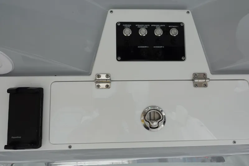 Slide: The Image of Control panel of 2025 Sea Fox 268 Commander boat with switches and storage compartment. - 3