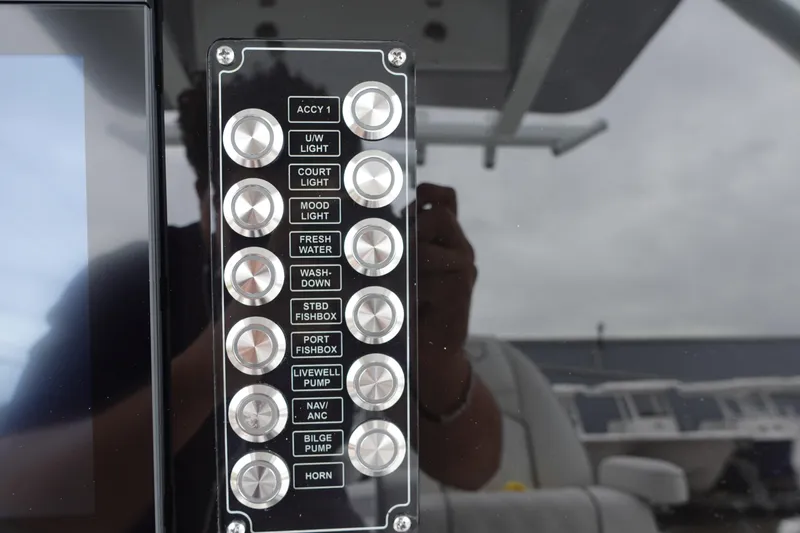 Slide: The Image of Control panel of 2025 Sea Fox 268 Commander boat with labeled buttons. - 6