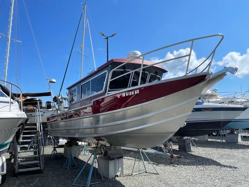 Slide: The Image of 2018 Duckworth 28 Offshore boat on dry dock, surrounded by other vessels. - 15
