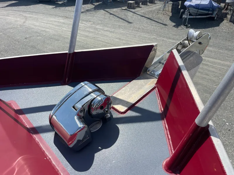 Slide: The Image of 2018 Duckworth 28 Offshore boat deck with anchor winch and red railing. - 22