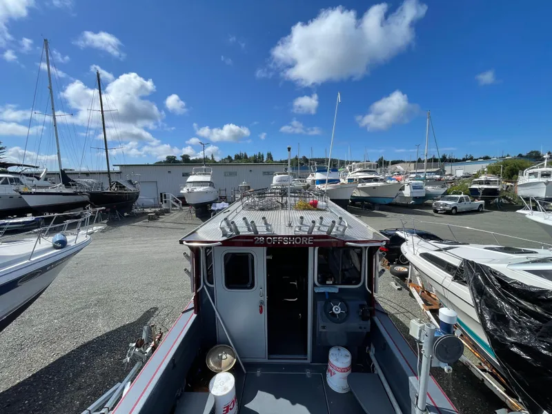 Slide: The Image of 2018 Duckworth 28 Offshore boat in a marina with clear blue skies. - 25