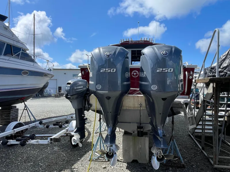 Slide: The Image of 2018 Duckworth 28 Offshore boat with twin Yamaha 250 engines in a marina. - 27