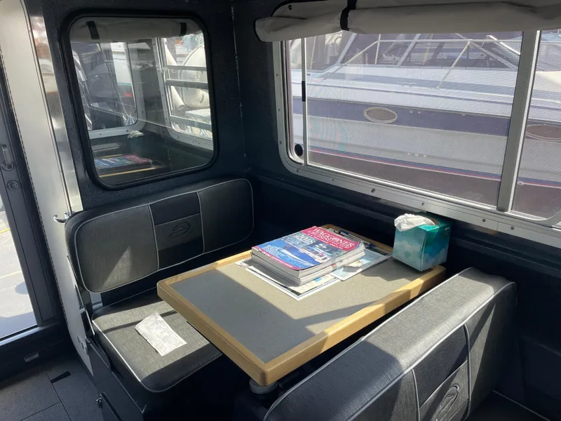 Slide: The Image of Interior of a 2018 Duckworth 28 Offshore boat with seating and table. - 41