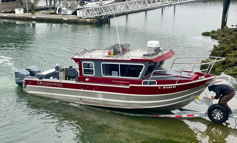Slide: The Image of 2018 Duckworth 28 Offshore boat being launched at a marina. - 5