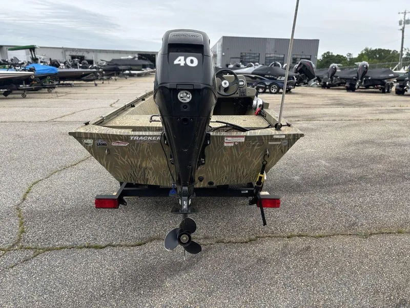 Slide: The Image of 2020 Tracker GRIZZLY® 1648 SC boat with 40 HP motor, parked in a lot. - 10