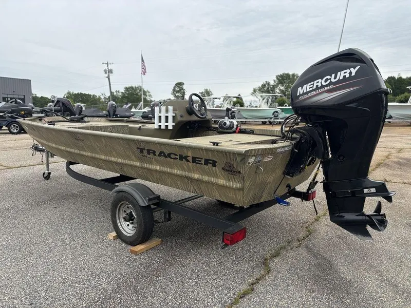 Slide: The Image of 2020 Tracker GRIZZLY® 1648 SC boat with Mercury outboard motor on a trailer. - 11