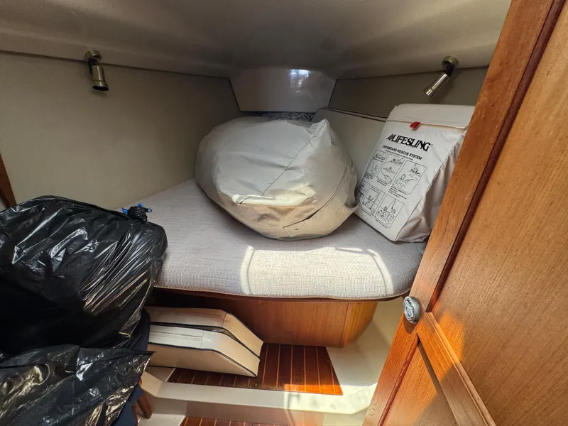 Slide: The Image of Interior cabin of 1992 Hunter Legend 375 sailboat with storage items. - 16