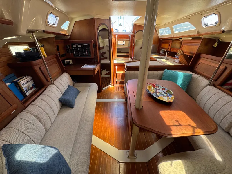 Slide: The Image of Interior of 1992 Hunter Legend 375 sailboat with cozy seating and wooden finishes. - 18