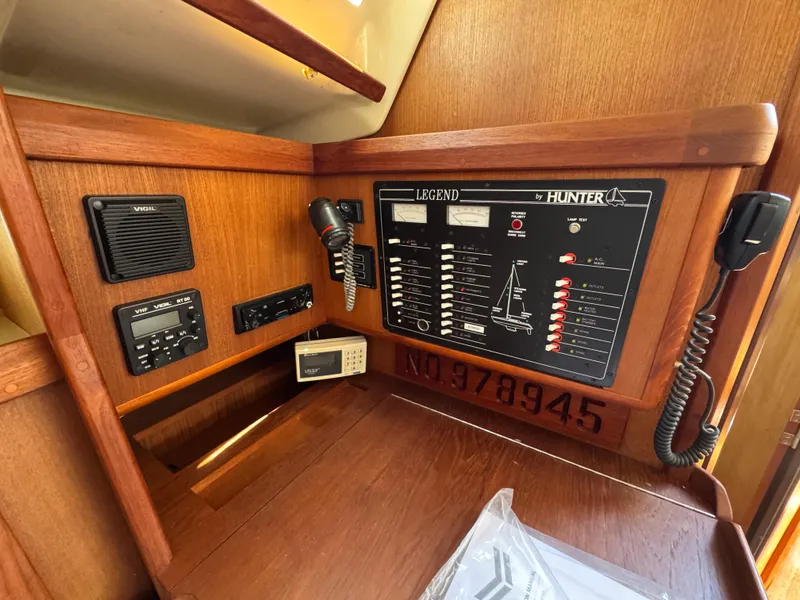 Slide: The Image of Hunter Legend 375 yacht control panel, 1992 model, featuring communication and navigation equipment. - 20