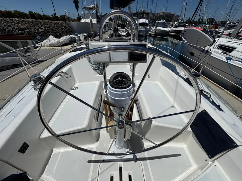 Slide: The Image of Cockpit of 1992 Hunter Legend 375 sailboat with steering wheel and compass. - 9