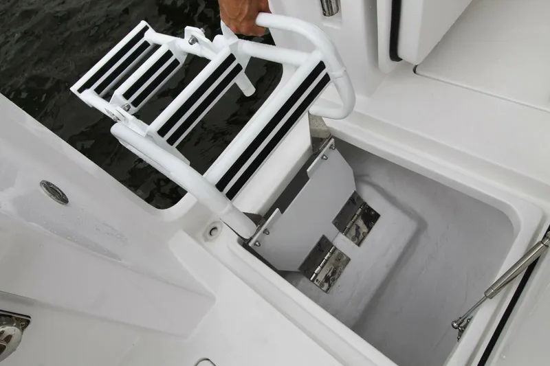Slide: The Image of 2024 Intrepid 375 Nomad SE boat ladder and storage compartment detail. - 23