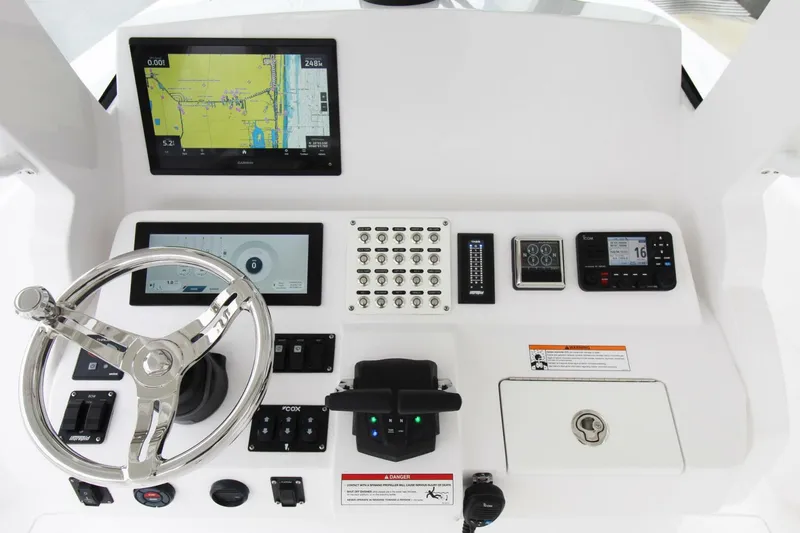 Slide: The Image of 2024 Intrepid 375 Nomad SE helm with advanced navigation and control systems. - 8