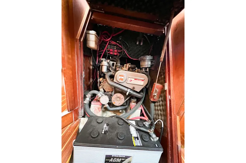 Slide: The Image of Engine compartment of a 2002 Beneteau 361 sailboat with visible battery and wiring. - 37
