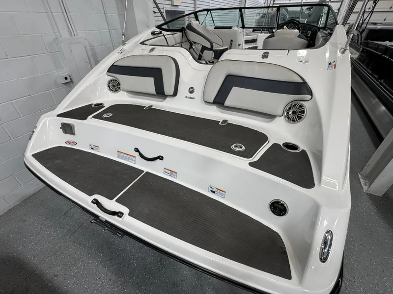 Slide: The Image of 2014 Yamaha Boats 212X, sleek design, spacious seating, modern interior, ideal for water sports. - 2