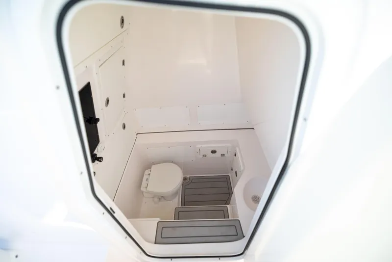 Slide: The Image of Interior of 2026 Reef Runner 340 boat bathroom with modern fixtures. - 9