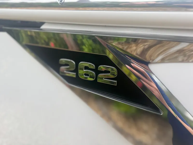 Slide: The Image of 2026 Blackfin 262 HB boat emblem with reflective chrome finish. - 10