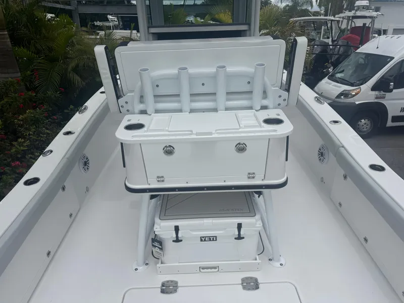 Slide: The Image of 2026 Blackfin 262 HB boat deck with rod holders and storage compartments. - 17