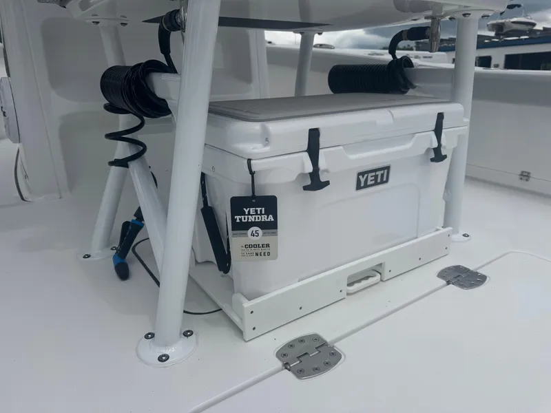 Slide: The Image of YETI Tundra cooler on 2026 Blackfin 262 HB boat deck, secured and ready for use. - 19