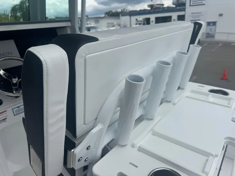 Slide: The Image of 2026 Blackfin 262 HB boat seat with rod holders, featuring sleek white and black design. - 22