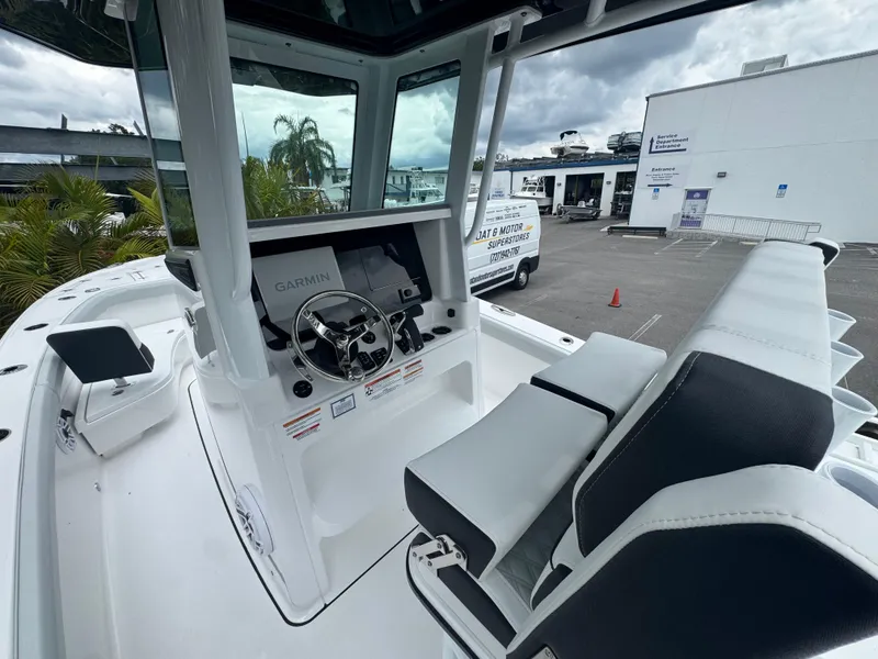 Slide: The Image of 2026 Blackfin 262 HB boat interior with Garmin navigation system and dual seating. - 23