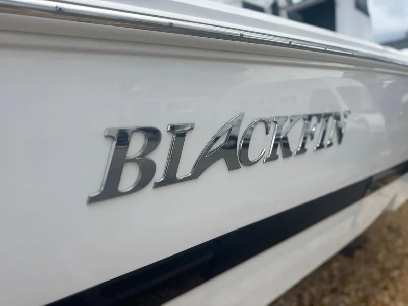 Slide: The Image of 2026 Blackfin 262 HB boat with sleek white exterior and chrome logo. - 3