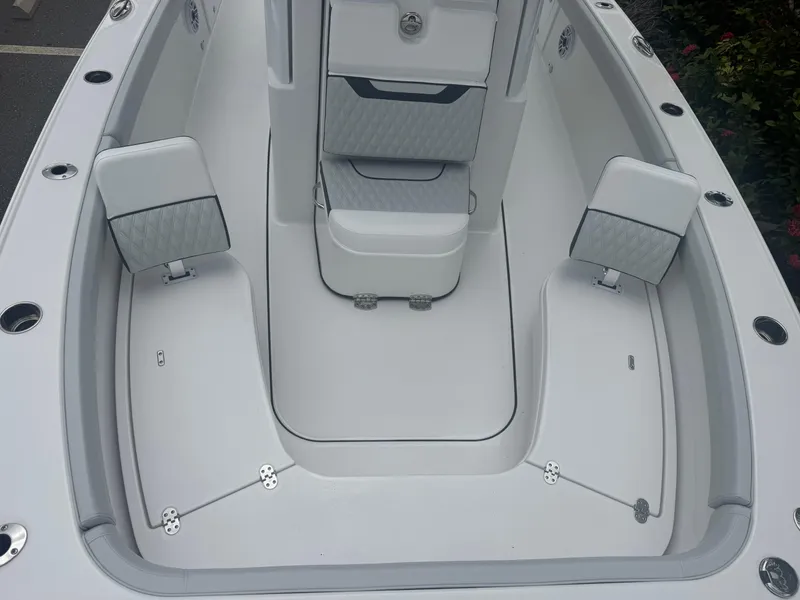 Slide: The Image of 2026 Blackfin 262 HB boat interior with sleek white seating and modern design. - 36