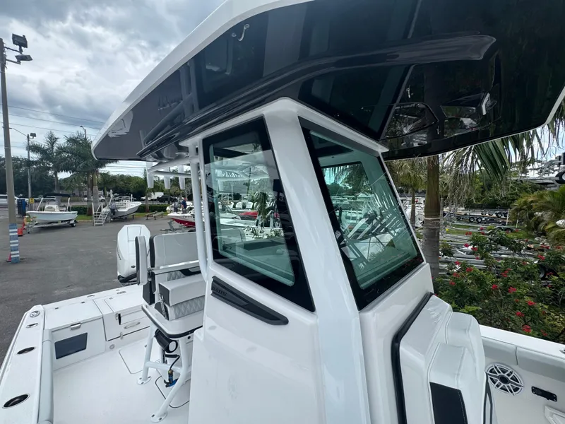 Slide: The Image of 2026 Blackfin 262 HB boat with sleek design and modern features, docked outdoors. - 41