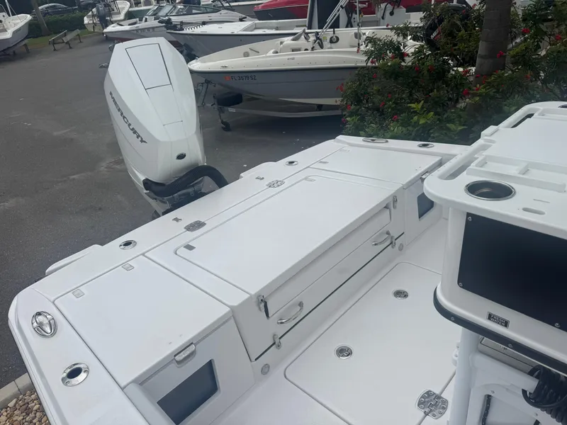 Slide: The Image of 2026 Blackfin 262 HB boat with sleek white deck and powerful outboard motor. - 46