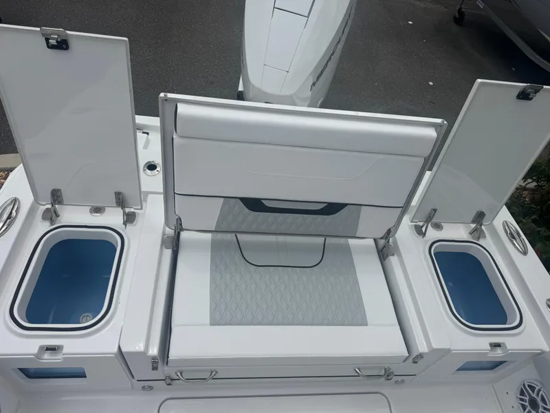 Slide: The Image of 2026 Blackfin 262 HB boat with open storage compartments and seating area. - 48