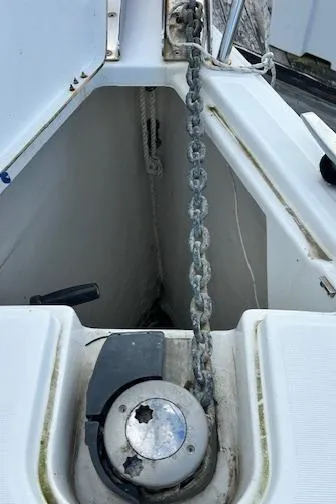 Slide: The Image of Anchor chain and windlass on 2012 Jeanneau Sun Odyssey 379 sailboat. - 10