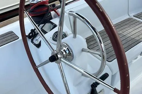 Slide: The Image of Steering wheel of 2012 Jeanneau Sun Odyssey 379 sailboat with wooden accents. - 14
